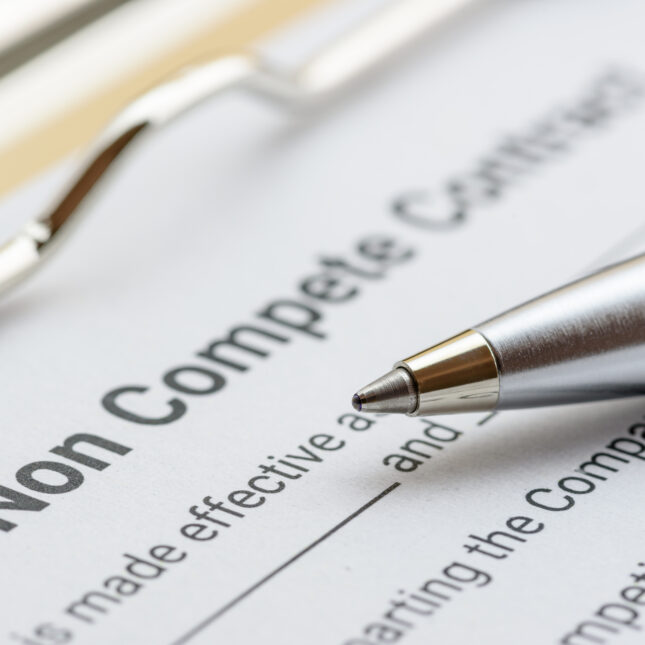 Photo of a noncompete contract with a pen. -- health tech coverage from STAT