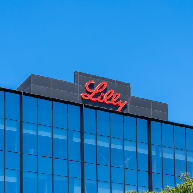 A sign of Lilly on the top of its biotechnology center — coverage from STAT