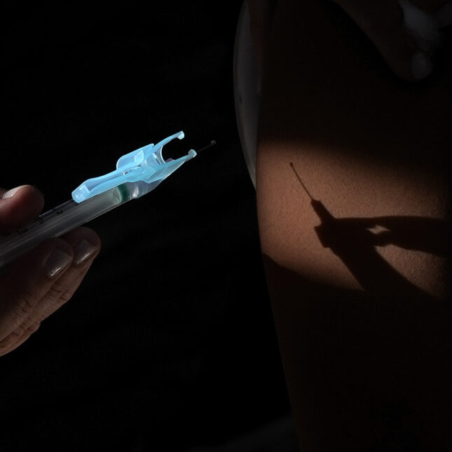 The shadow of a vaccine was casted on the arm of a person receiving the shot — first opinion coverage from STAT