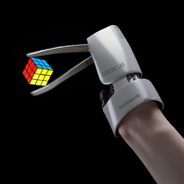 A tweezer-like prosthetic holds a Rubik's cube — health tech coverage from STAT