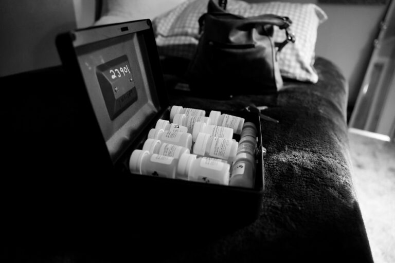 A photograph of take home doses on methadone in a lock box at a patient's home