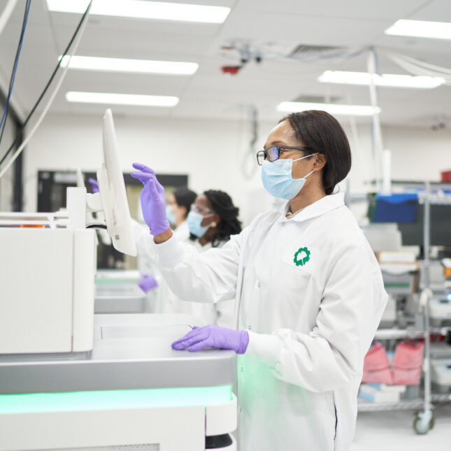 Ginkgo scientists sequencing biologicl material at their office in the Seaport district.