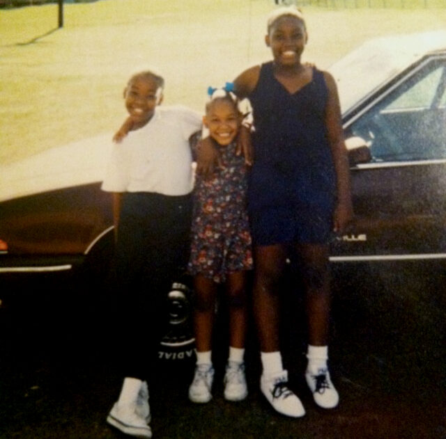 An old photo of Whitney, Kalia, and Raven in childhood